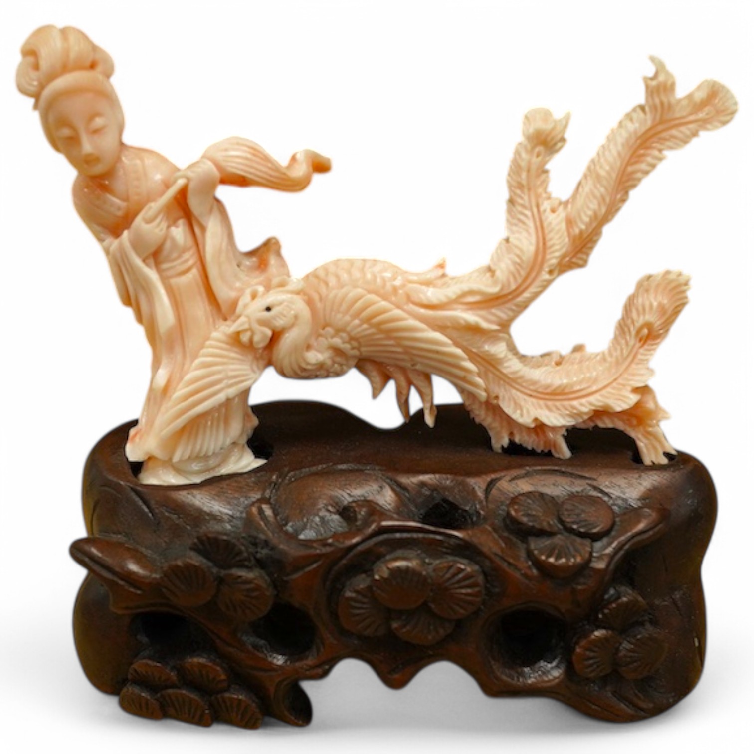 A Chinese coral group of a lady and a phoenix on carved hardwood base, 11cm high. Condition - good